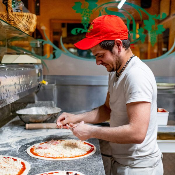 Florios pizzaiolo stretching fresh dough